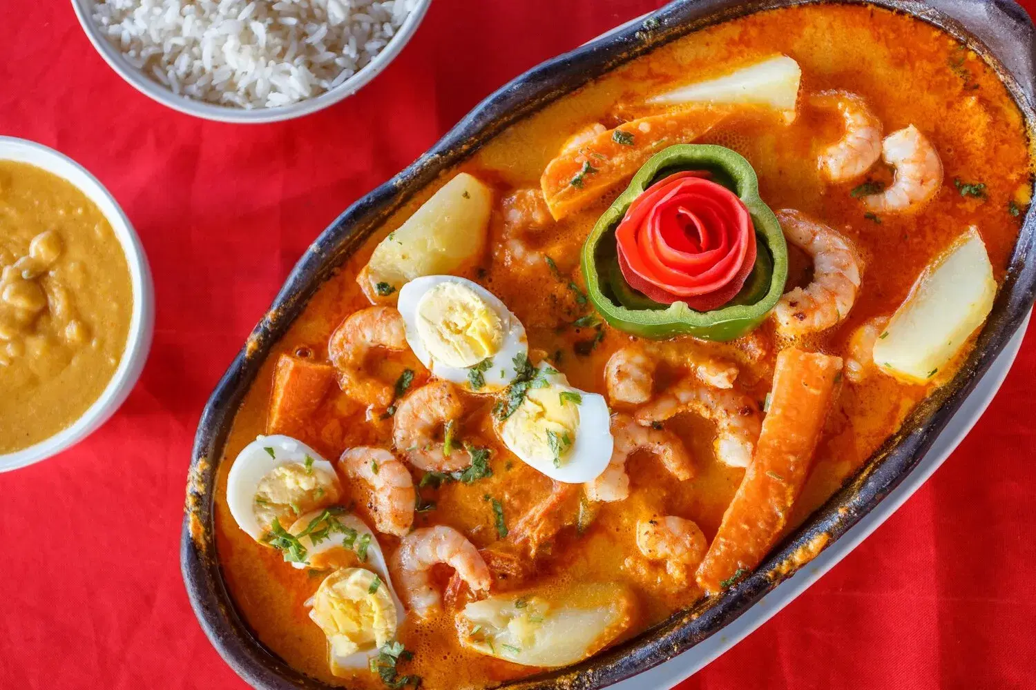 Moqueca Baiana Moqueca Baiana https://4kym48m6w0dj35od.public.blob.vercel-storage.com/dishes/internal/moqueca-baiana-1759361276698.webp